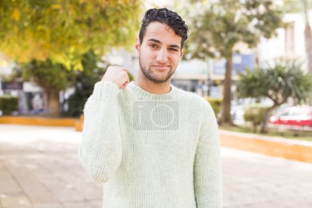 Photo for Young hispanic man feeling stressed, anxious, tired and frustrated, pulling shirt neck, looking frustrated with problem - Royalty Free Image