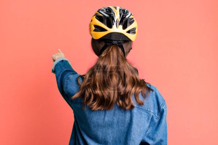 Photo for Young pretty woman with a bike helmet - Royalty Free Image