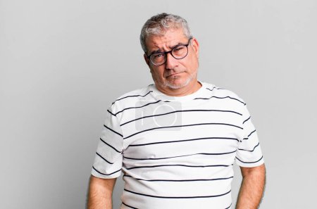Photo for Middle age senior man feeling sad and whiney with an unhappy look, crying with a negative and frustrated attitude - Royalty Free Image