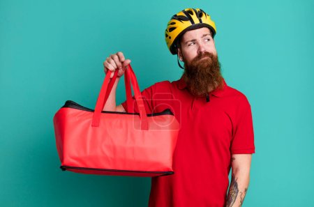 Photo for Long beard man feeling sad, upset or angry and looking to the side. pizza delivery concept - Royalty Free Image