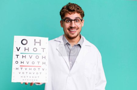 Photo for Young adult caucasian man looking happy and pleasantly surprised. optical vision test concept - Royalty Free Image