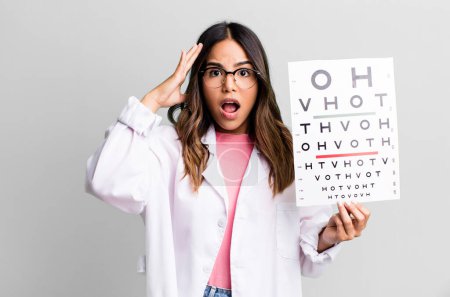 Photo for Hispanic pretty woman looking happy, astonished and surprised. optometry concept - Royalty Free Image