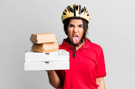 Photo for Hispanic pretty woman feeling disgusted and irritated and tongue out.  delivery woman and take away concept - Royalty Free Image