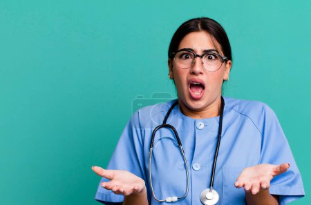 Photo for Amazed, shocked and astonished with an unbelievable surprise. nurse concept - Royalty Free Image