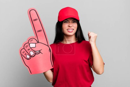 Photo for Hispanic pretty woman shouting aggressively with an angry expression. number one hand fan concept - Royalty Free Image