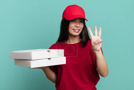 Photo for Hispanic pretty woman smiling and looking friendly, showing number three. delivery pizza concept - Royalty Free Image