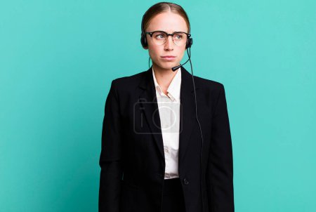 Photo for Caucasian pretty woman feeling sad, upset or angry and looking to the side. telemarketing concept - Royalty Free Image