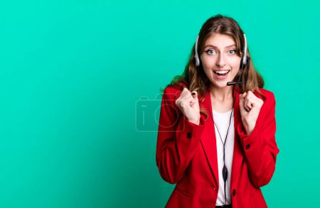 Photo for Caucasian pretty woman feeling shocked,laughing and celebrating success. telemarketer agent concept - Royalty Free Image
