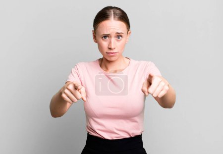Photo for Pointing forward at camera with both fingers and angry expression, telling you to do your duty - Royalty Free Image