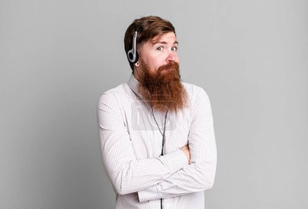 Photo for Long beard man shrugging, feeling confused and uncertain. telemarketer agent concept - Royalty Free Image