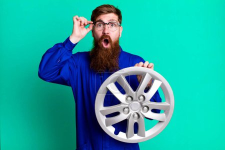 Photo for Long beard man looking surprised, realizing a new thought, idea or concept. car mechanic concept - Royalty Free Image