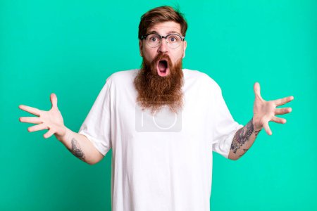 Photo for Long beard and red hair man feeling extremely shocked and surprised - Royalty Free Image