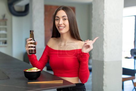 Photo for Smiling cheerfully, feeling happy and pointing to the side. ramen noodles bar concept - Royalty Free Image