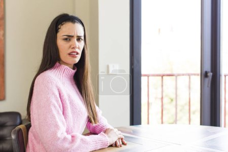 Photo for Pretty caucasian woman feeling terrified and shocked, with mouth wide open in surprise - Royalty Free Image
