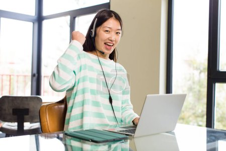 Photo for Asian pretty telemarketer woman and teleconmmuting concept - Royalty Free Image