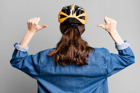 Photo for Young pretty woman with a bike helmet - Royalty Free Image