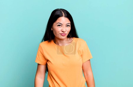 Photo for Pretty latin woman looking goofy and funny with a silly cross-eyed expression, joking and fooling around - Royalty Free Image