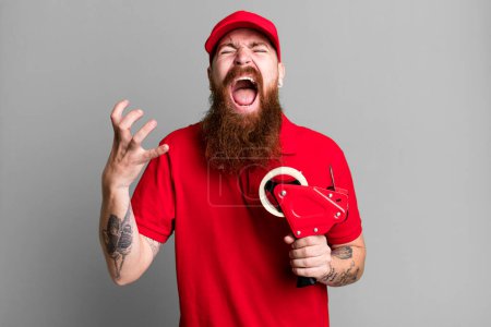 Photo for Long beard man looking desperate, frustrated and stressed. shipping packer concept - Royalty Free Image