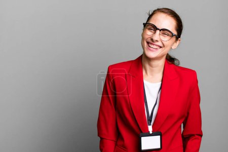 Téléchargez les photos : Young adult pretty businesswoman and a accreditation pass card id - en image libre de droit