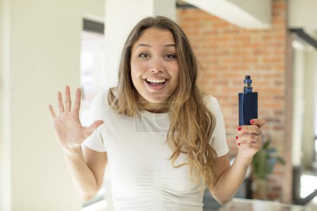 Photo for Pretty woman feeling happy and astonished at something unbelievable. vaper concept - Royalty Free Image