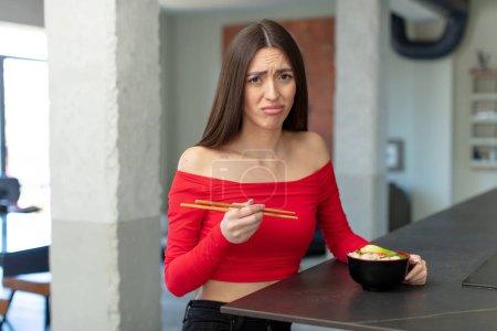 Photo for Feeling sad and whiney with an unhappy look and crying. ramen noodles bar concept - Royalty Free Image