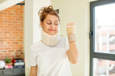 Photo for Young pretty woman smiling and looking with a happy confident expression. accident collar concept - Royalty Free Image