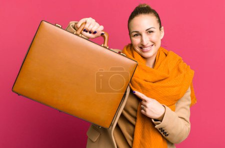 Photo for Young pretty woman with a leather case and dollar banknotes - Royalty Free Image