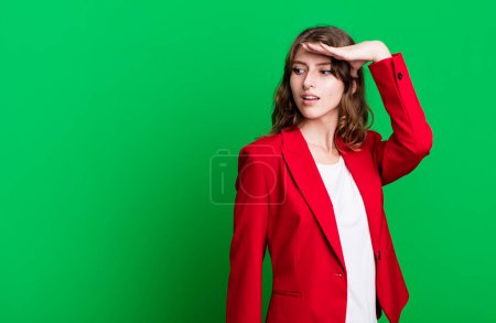 Photo for Caucasian pretty blonde womanwearing a red blazer. businesswoman concept - Royalty Free Image