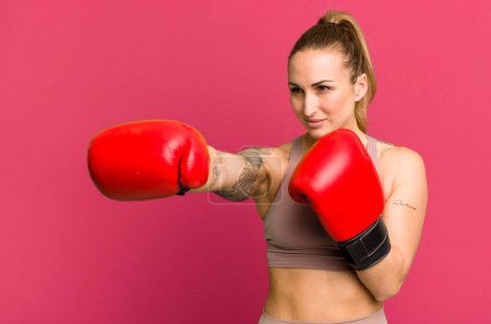 Photo for Young pretty woman boxing and fitness concept - Royalty Free Image