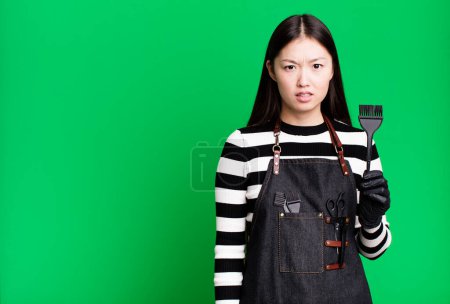 Photo for Pretty asian woman feeling puzzled and confused. barber concept - Royalty Free Image