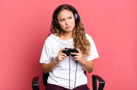 Photo for Hispanic pretty woman feeling sad, upset or angry and looking to the side. gamer concept - Royalty Free Image