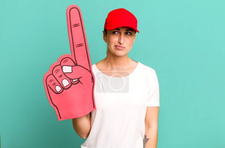 Photo for Young pretty woman feeling sad, upset or angry and looking to the side. number one fan concept - Royalty Free Image
