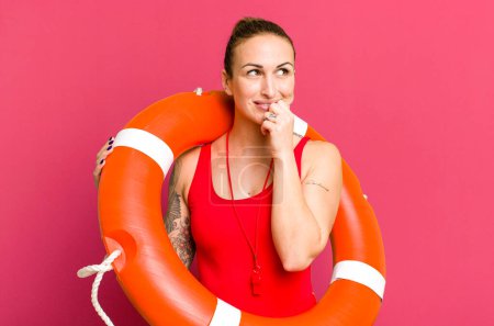 Photo for Young pretty woman smiling with a happy, confident expression with hand on chin. summer and lifeguard concept - Royalty Free Image