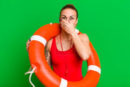 Photo for Young pretty woman covering mouth with hands with a shocked. summer and lifeguard concept - Royalty Free Image