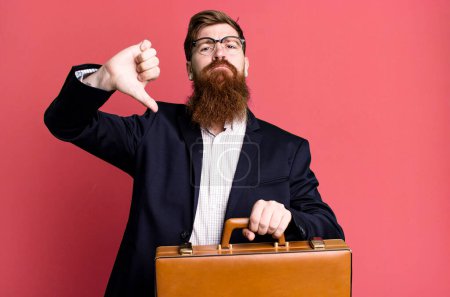Photo for Young adult red hair bearded cool businessman with a leather suitcase - Royalty Free Image