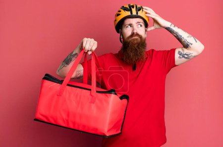 Photo for Long beard man smiling happily and daydreaming or doubting. pizza delivery concept - Royalty Free Image