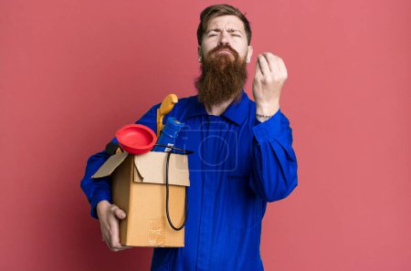Photo for Long beard man making capice or money gesture, telling you to pay. repairman with toolbox concept - Royalty Free Image