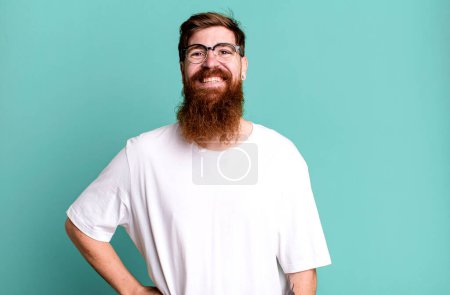 Photo for Long beard and red hair man smiling happily with a hand on hip and confident - Royalty Free Image