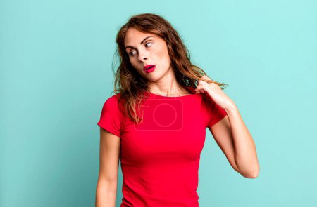 Photo for Young pretty woman feeling stressed, anxious, tired and frustrated, pulling shirt neck, looking frustrated with problem - Royalty Free Image