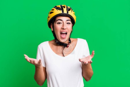 Photo for Amazed, shocked and astonished with an unbelievable surprise. bike helmet concept - Royalty Free Image