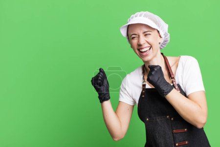 Photo for Pretty blonde woman butcher concept with a copy space - Royalty Free Image