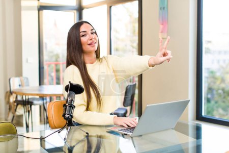 Photo for Young pretty influencer woman telecommuting at home - Royalty Free Image