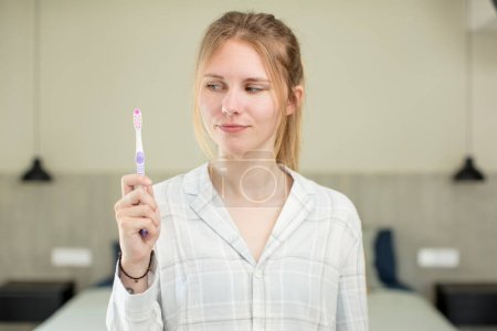 Photo for Young pretty woman smiling and looking with a happy confident expression. toothwash concept - Royalty Free Image