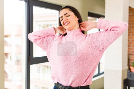 Photo for Pretty caucasian woman feeling anxious, ill, sick and unhappy, suffering a painful neck ache - Royalty Free Image
