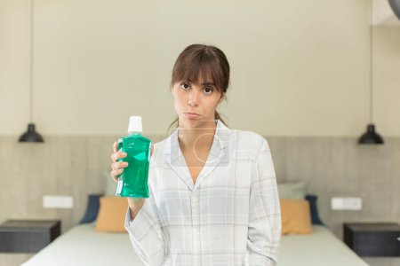 Photo for Young pretty woman feeling sad and whiney with an unhappy look and crying. mouthwash concept - Royalty Free Image