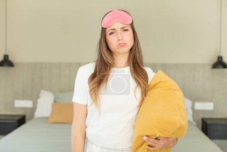 Photo for Pretty woman feeling sad and whiney with an unhappy look and crying.  nightwear concept - Royalty Free Image