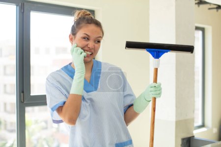 Photo for Pretty woman feeling scared, worried or angry and looking to the side. housekeeper concept - Royalty Free Image