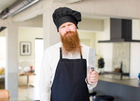 Photo for Red hair man feeling sad and whiney with an unhappy look and crying. chef concept - Royalty Free Image