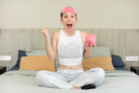 Photo for Feeling shocked,laughing and celebrating success. piggy bank concept - Royalty Free Image