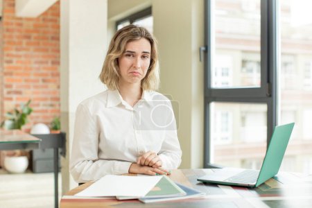 Photo for Pretty woman feeling sad and whiney with an unhappy look and crying. home work telecommuting concept - Royalty Free Image